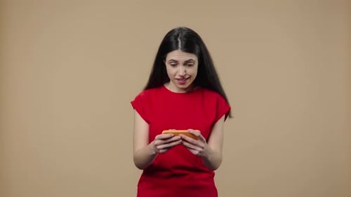 Excited Woman Playing Game on Smartphone