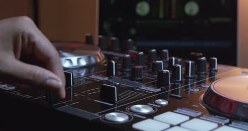 Close Up of a DJ Mixing Board