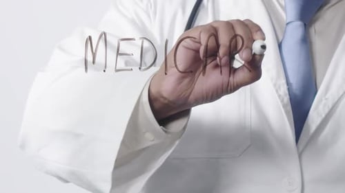 Asian Doctor Writing Medicare