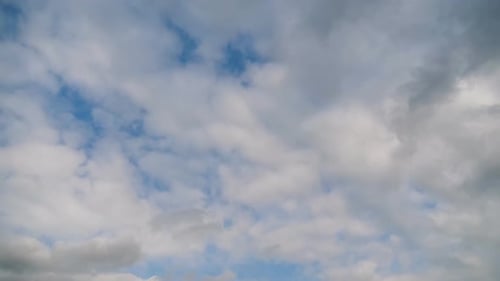 Clouds Drifting Across a Blue Sky