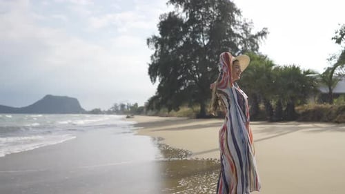 4K Portrait of Beautiful Caucasian woman walking on tropical beach in summer sunny day