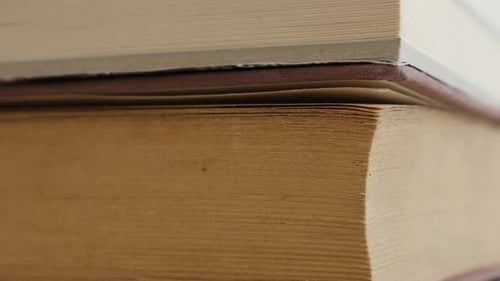 Tilting on deckle edge paper material or archives pile 4K 2160p 30fps UltraHD footage - Close-up o