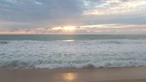 Beautiful sea waves and white sand beach in the tropical island.