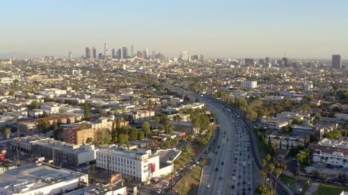 Cars and trucks on road traffic on highway to downtown, USA, LA