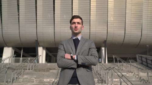 Businessman in suit standing outside the office