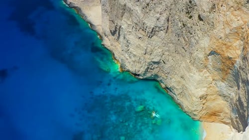 Aerial seascape at the day time. Sea bay and rocks from drone.