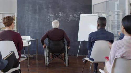 Professor Gives Presentation to Students in Classroom