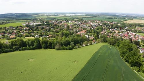 Aerial Drone Shot a Picturesque Town Surrounded By Fields in a Rural Area Drone Flies Forward