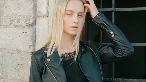 Beautiful Blonde Woman Posing in Urban Setting