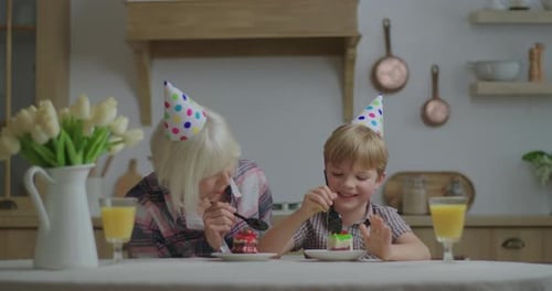 Grandmother and Child Celebrating a Birthday with Cake