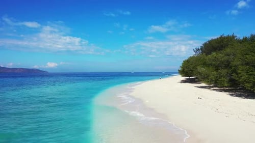 Aerial drone shot texture of relaxing island beach journey by shallow lagoon with white sandy backgr