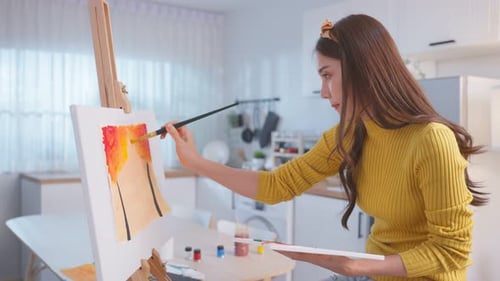 Asian young talented woman artist draw art picture, creating artwork with watercolor paint and brush