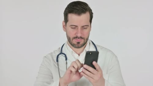 Male Doctor Using Cellphone in the Office