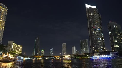metropolis at night. light from the windows of offices in the skyscrapers in bangkok