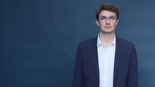 Young Adult Man Wearing Jacket and Glasses