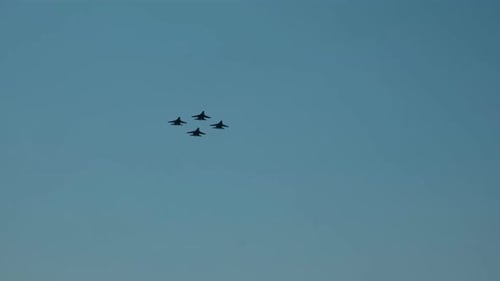 A Group of Fighters Flying in the Sky.