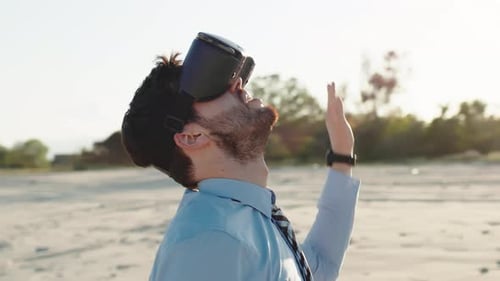 Young Adult Immersed in VR on Beach