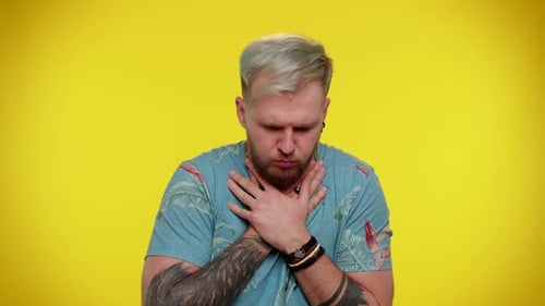 Man Struggling to Breath Clutches at His Throat