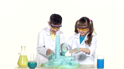 Children Doing Science Experiment with Foam Eruption