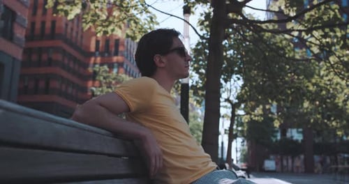Man sits on park bench