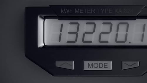 Digital electricity meter showing household consumption in kilowatt hours.