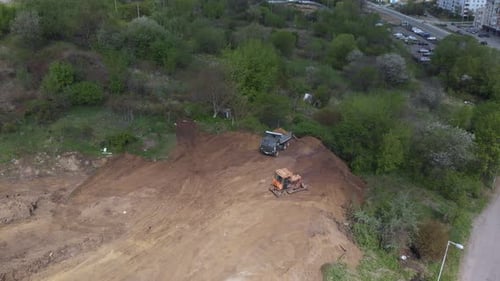 Aerial View of Construction Site With Truck and Bulldozer