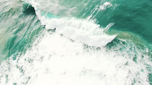 High Ocean Wave with White Foam Rolls on Beach Slow Motion