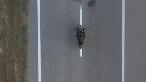 Top View to Biker Riding on Modern Sport Motorbike at Highway