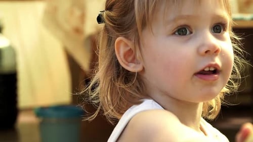 Blond Child Talking, Close-Up View