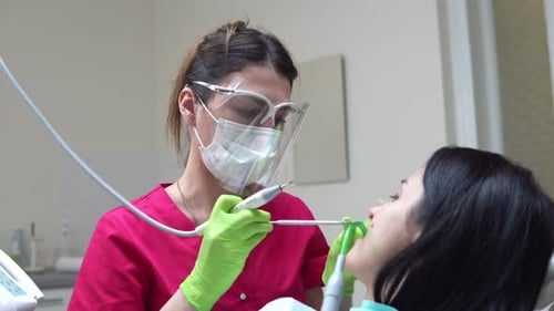 Dentist Working on Patient in Modern Clinic