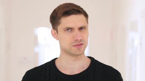 Shaking Head to No Rejecting Middle Aged Man Sitting in Office