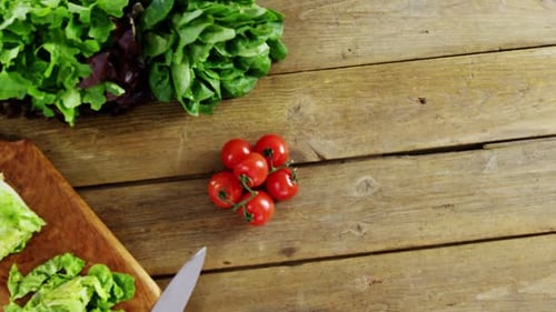 Fresh Vegetables and Tomatoes on a Wooden Table