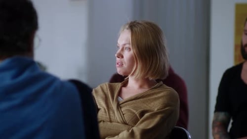 Woman Speaking to Group in Meeting