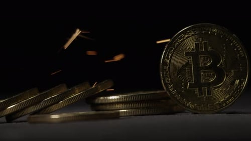 Cryptocurrency on the block chain - close up of bitcoin altcoin physical coins in dynamic setting