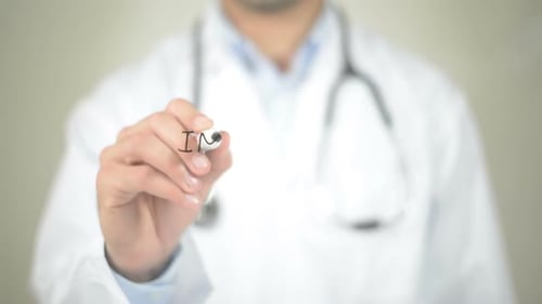 Doctor Writes the Word Implantation