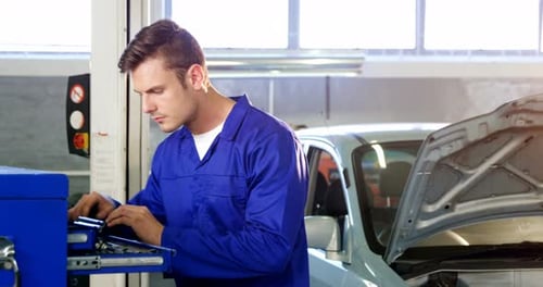 Mechanic servicing a car