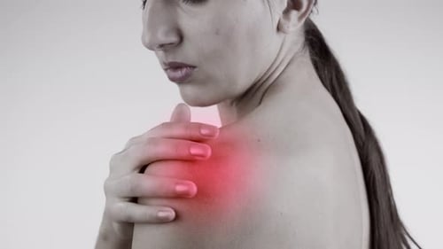 Woman Massaging Her Aching Shoulder, Close Up