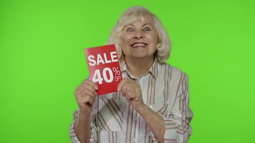 Senior Grandmother Showing Sale 40 Percent Off Banner Advertisement. Online Shopping. Black Friday