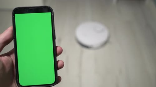 Hand Holding Cell Phone with Green Screen