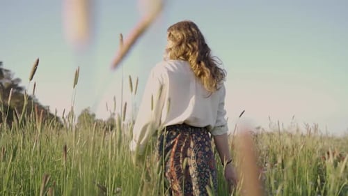 Following a girl through a field
