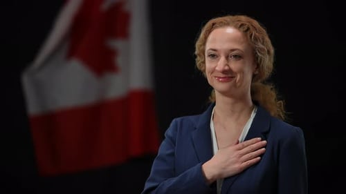 Woman with Hand Over Heart in Front of Flag