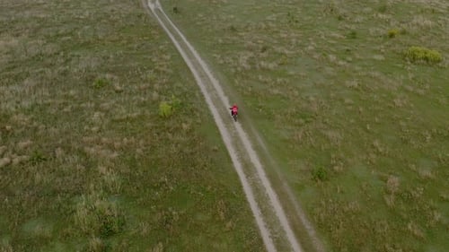 Above Aerial Drone Footage of Motorcycle Drivers Traveling on a Country Road