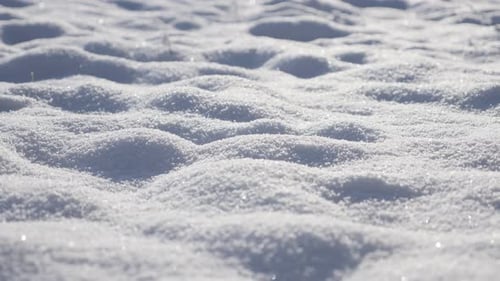 Slow pan over frozen crystalline water white snowflakes on the hill 4K 3840X2160 UHD panning video