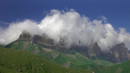 Mountains Landscape with Clouds and Green Grass