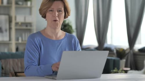Woman Uses Laptop and Claps in Home Environment