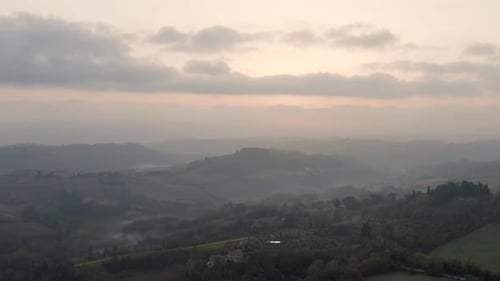 Aerial View of Misty Hills at Sunrise