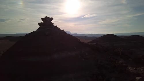 Panning view past desert hill in a creepy dark landscape