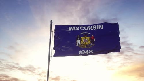 Waving Wisconsin State Flag Against a Sunset Sky