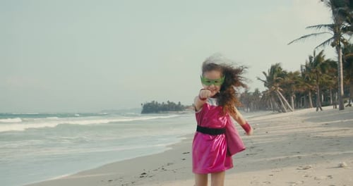 Plays on the Background of the Sea and the Blue Sky and Clouds Corrects the Green Mask on His Face