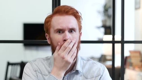 Man Shocked Expression, Covers Mouth in Surprise